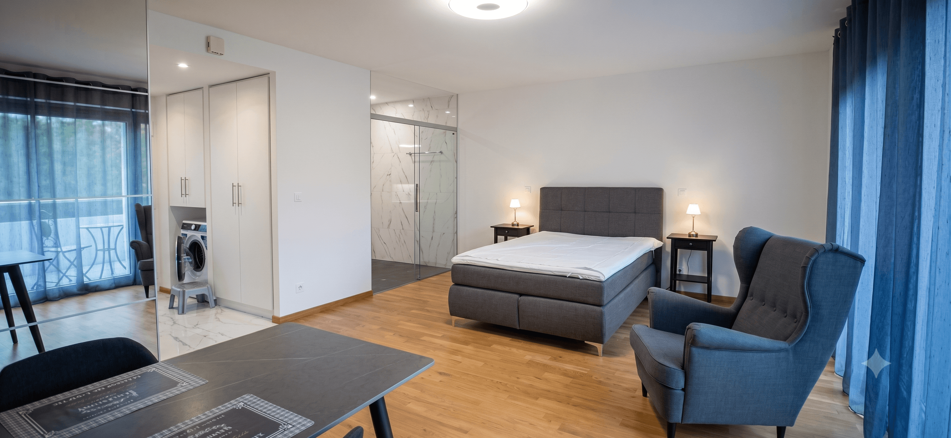 First floor studio living area with balcony