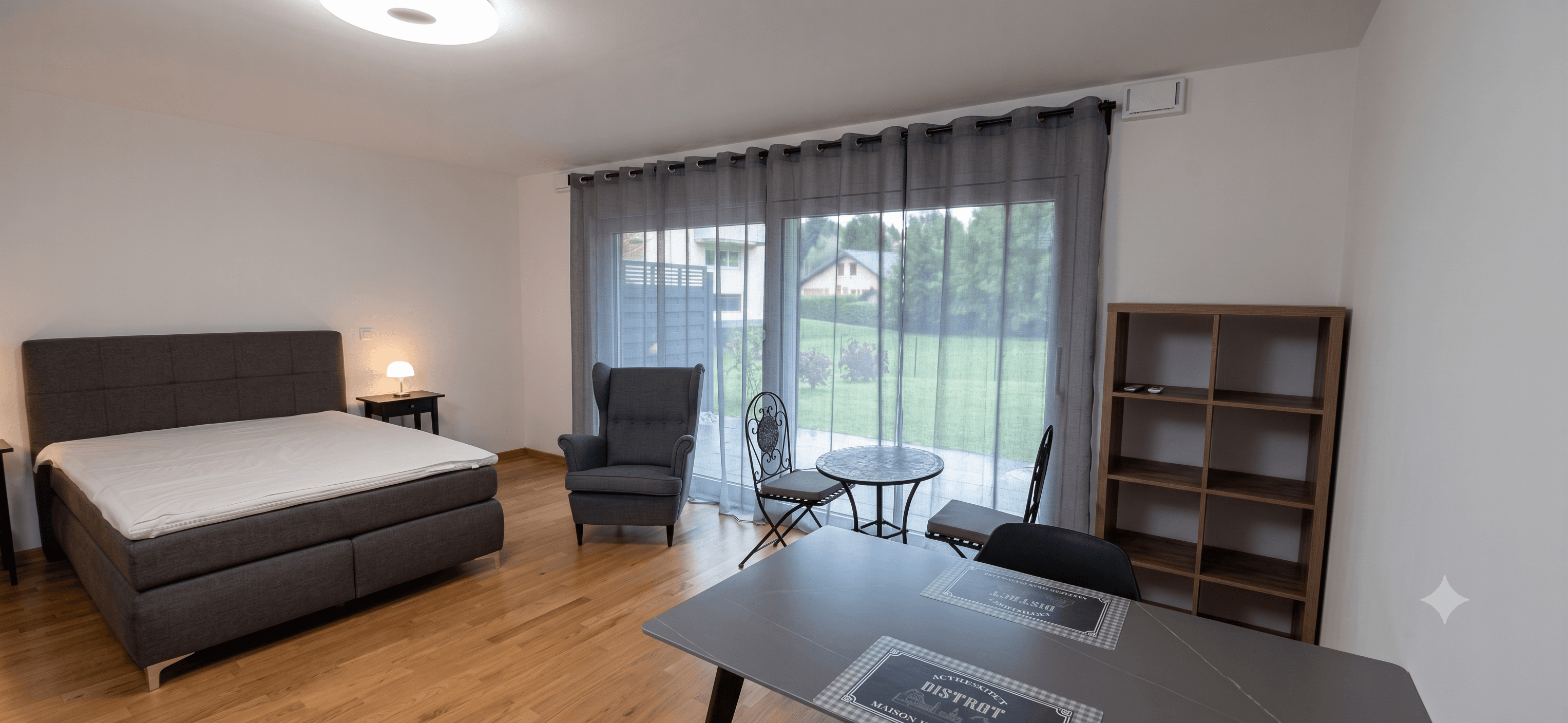 Ground floor studio living area with patio access